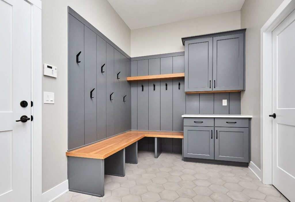 Organized and labeled lockers in a garage mudroom, perfect for family use.