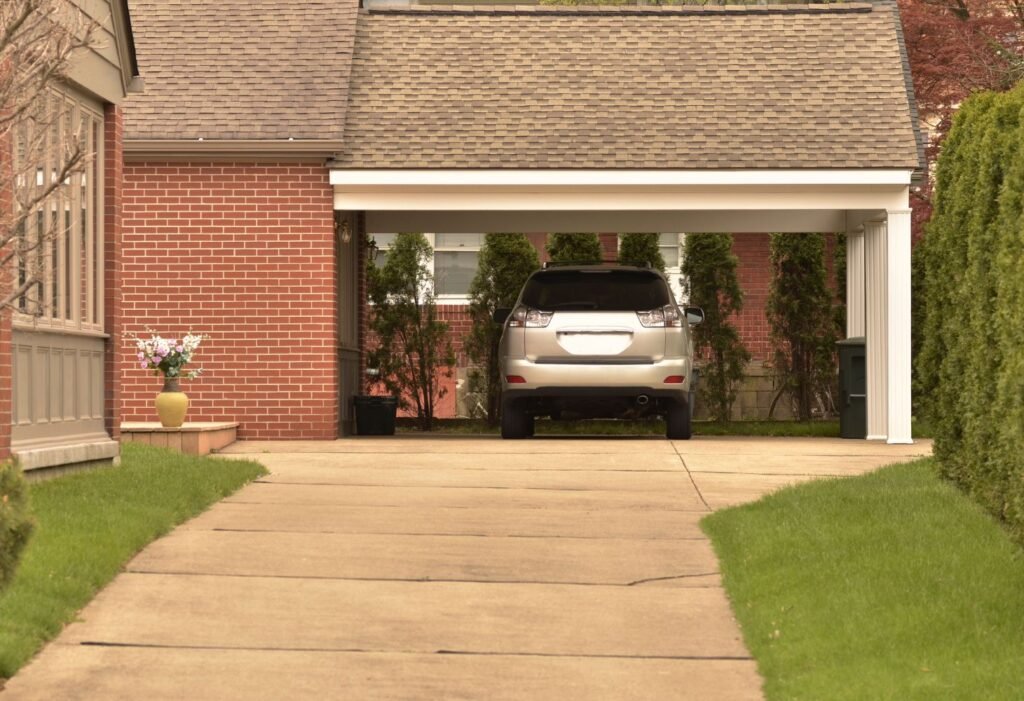 garage outside with a car built with a house