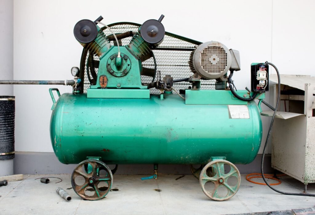 two cylinder air compressor in a garage